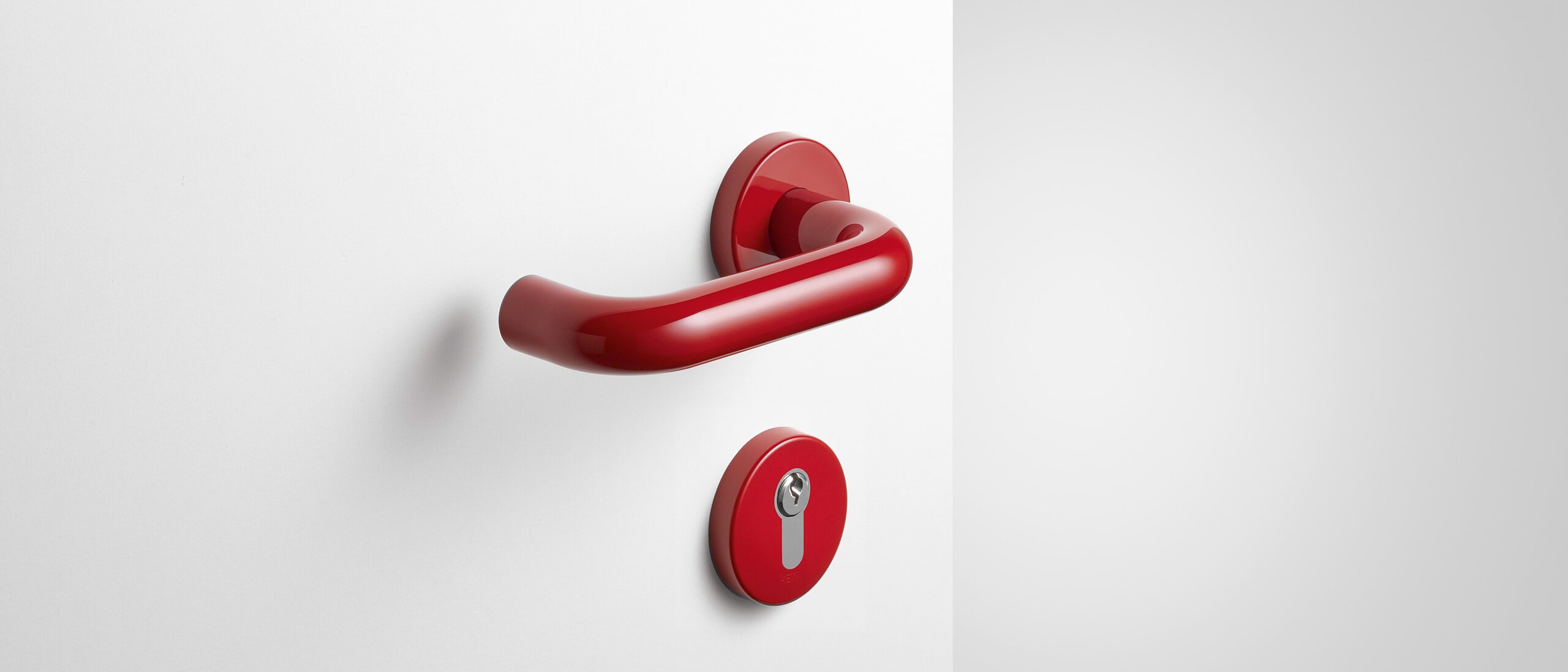 Lever handle with key rosette in the colour ruby red made of polyamide