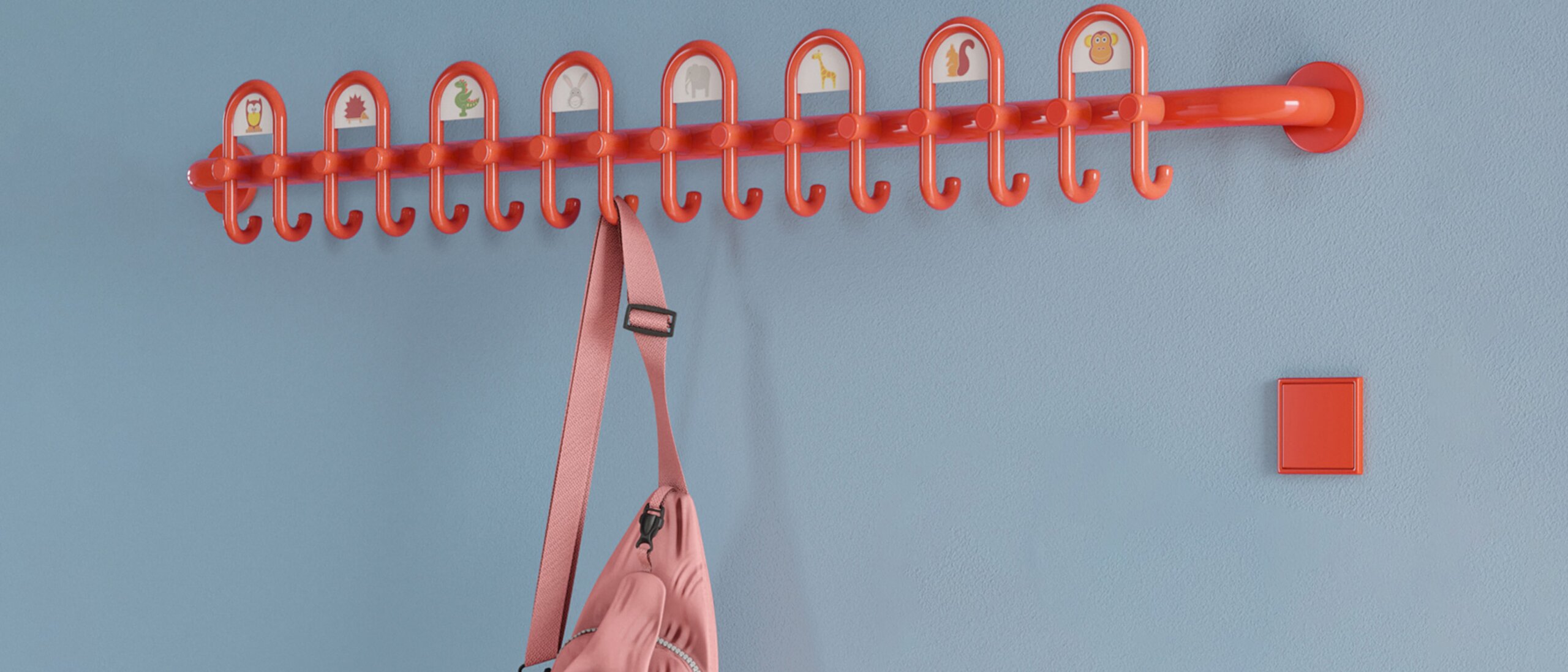 Colorful kindergarten equipped with fittings and wardrobe in the color orange