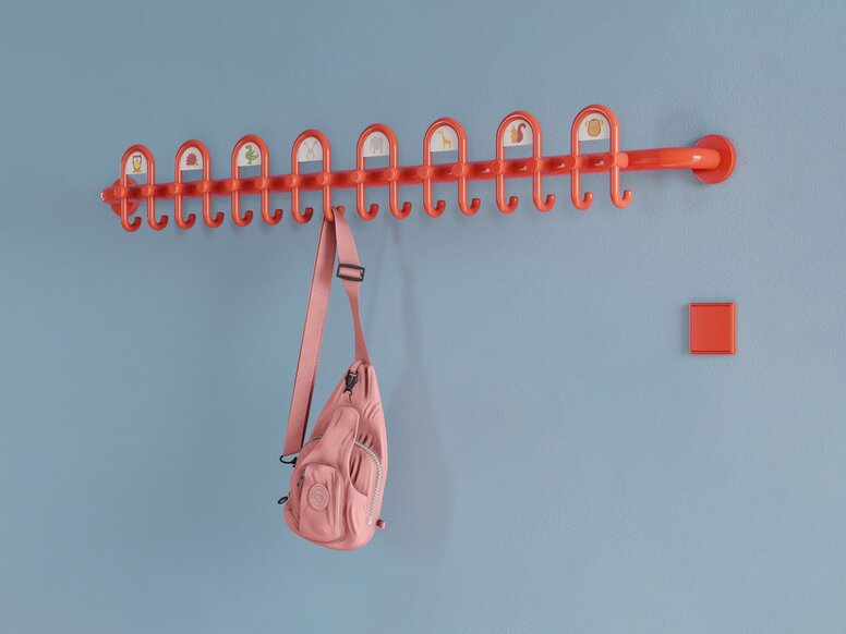 Colourful kindergarten equipped with fittings and wardrobe in the colour orange