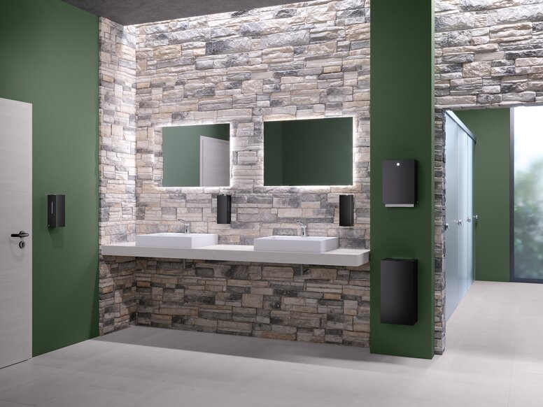Public WC equipped with soap, disinfectant and paper towel dispensers in matt black